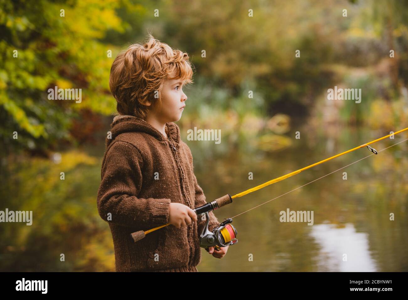 Boy Fishing Child Red Rod Catching Fish River Sunny Summer Stock Photo by  ©FamVeldman 247059248