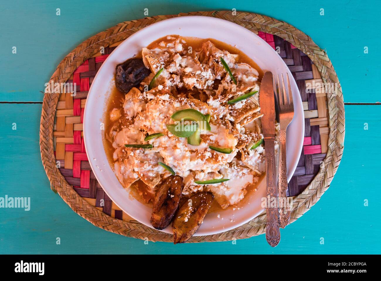 Chilaquiles with frijoles and fried plantains for breakfast in Ocosingo