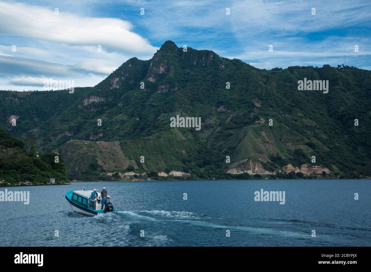 A view of the Nariz del Indio or the Indian's Nose as seen from San Pedro la Laguna on Lake Atitlan, Guatemala.  A boat taxi is in the foreground.  Th Stock Photo
