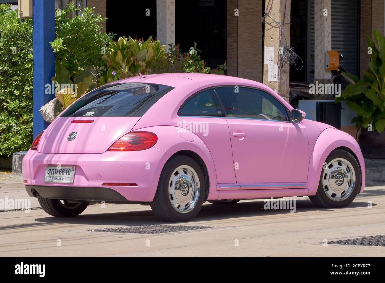 Volkswagen Beetle pink modern VW car. Thailand S. E. Asia. Pink classic car  Stock Photo - Alamy
