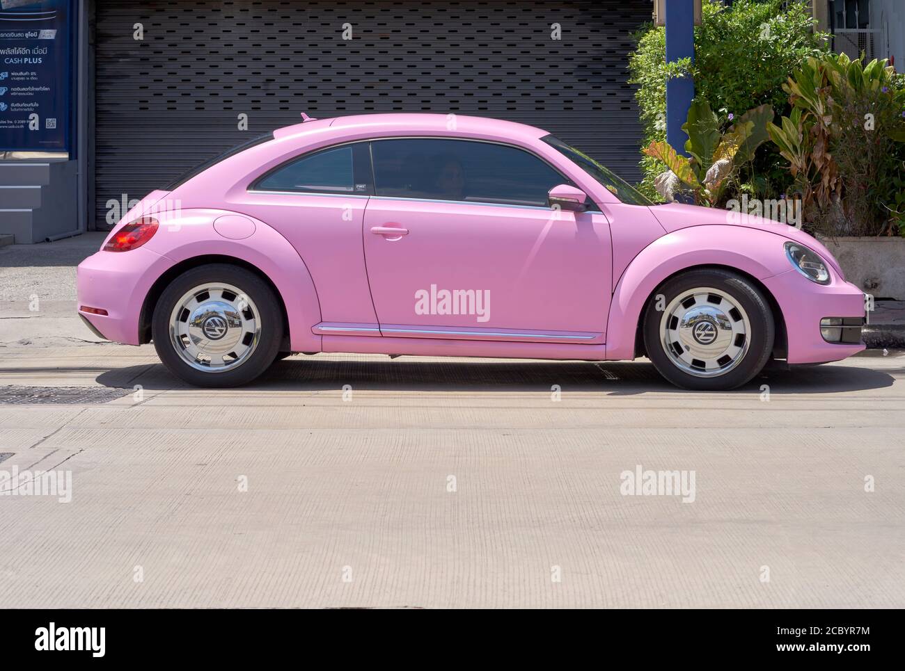 Volkswagen Beetle pink modern VW car. Thailand S. E. Asia. Pink classic car  Stock Photo - Alamy
