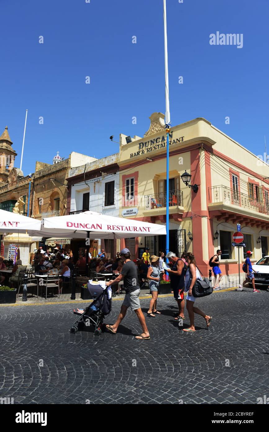 Tourist exploring the town of Marsaxlokk, Malta. Stock Photo
