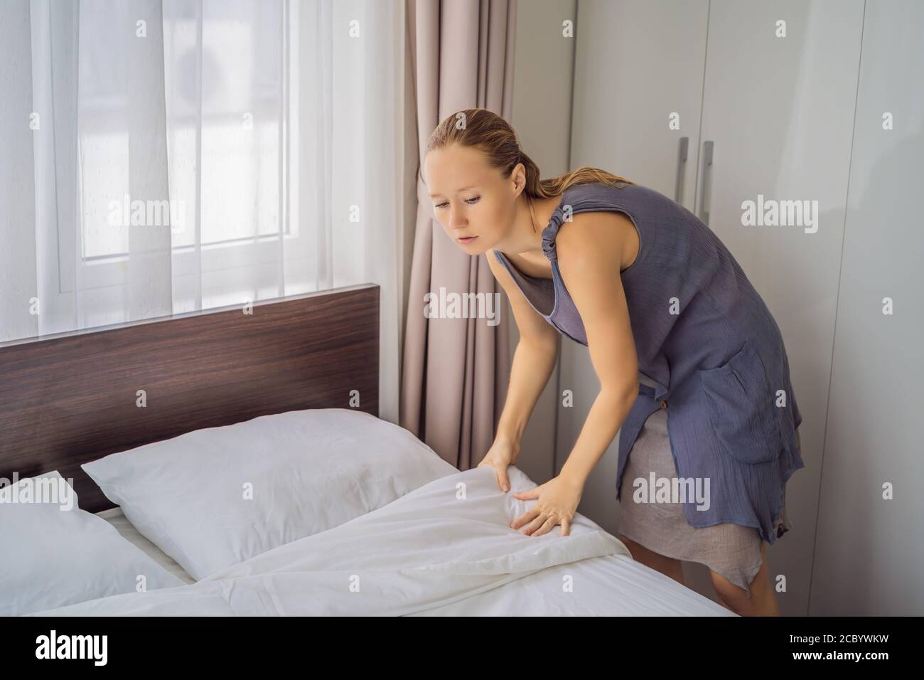 Woman sheet bed change hires stock photography and images Alamy