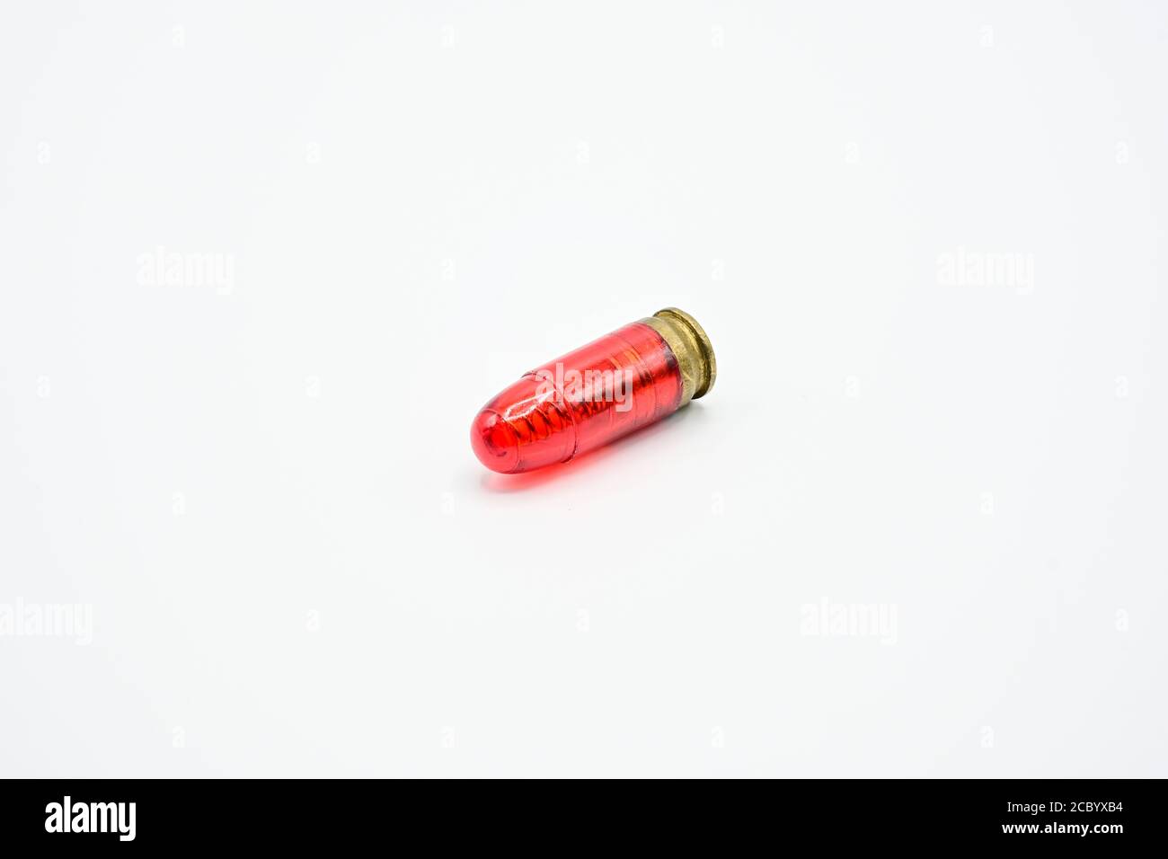 https://c8.alamy.com/comp/2CBYXB4/dry-fire-training-on-a-white-background-fake-bullets-made-from-red-plastic-are-used-for-shooting-practice-2CBYXB4.jpg