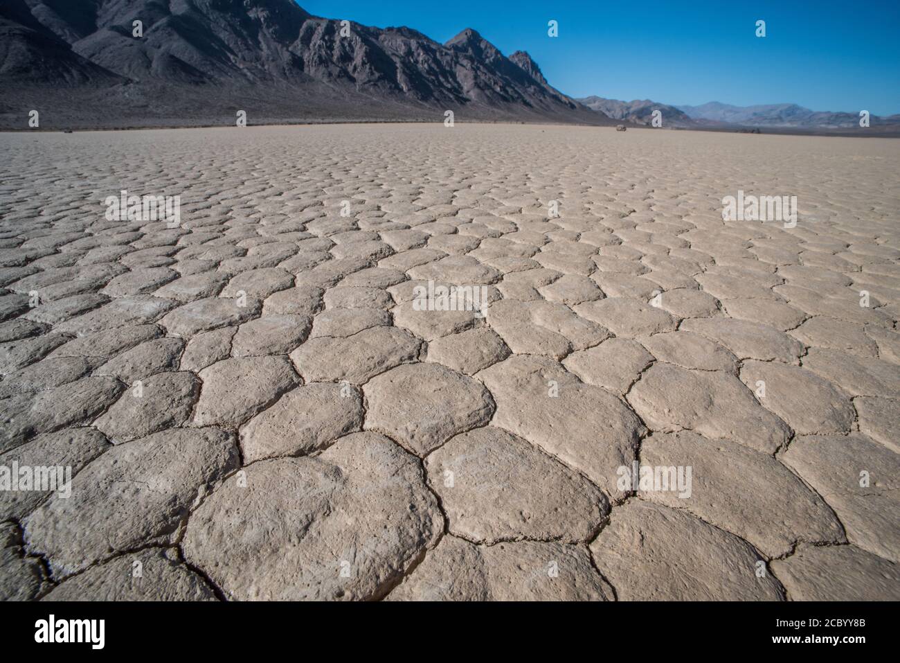 The racetrack in Death Valley National park, a dry lake leaves behind only cracked mud and sand. Stock Photo
