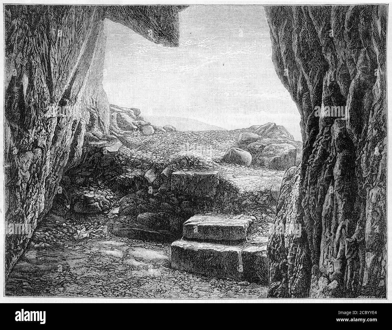 Engraving of St. Ninian's Cave, Glasserton, Wigtownshire, Scotland, which was excavated by Sir Herbert Maxwell. Ninian is first mentioned in the 8th century as a missionary among the Pictish peoples of what is now Scotland, and he is known as the Apostle to the Southern Picts. Stock Photo