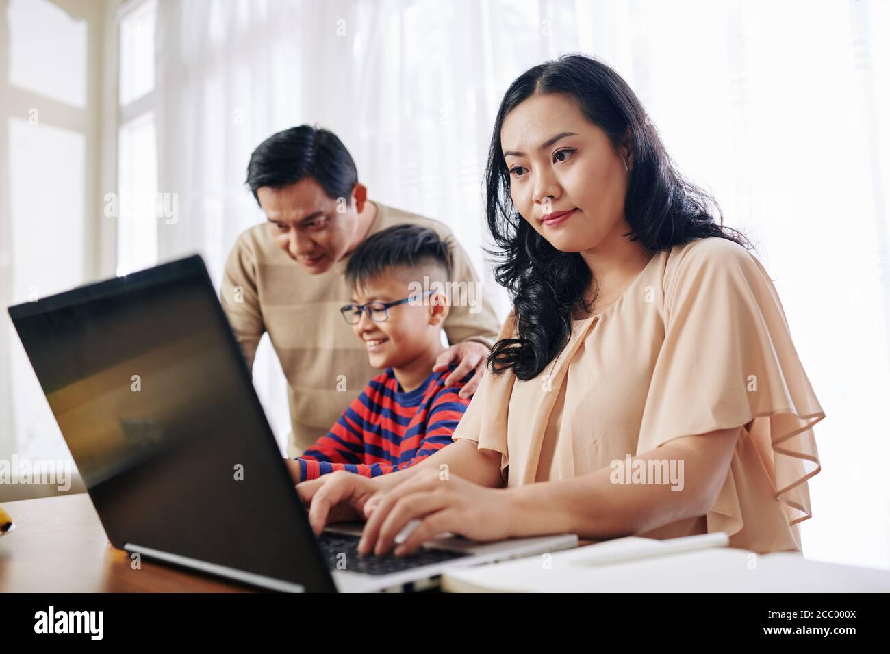 When mother is working from home Stock Photo