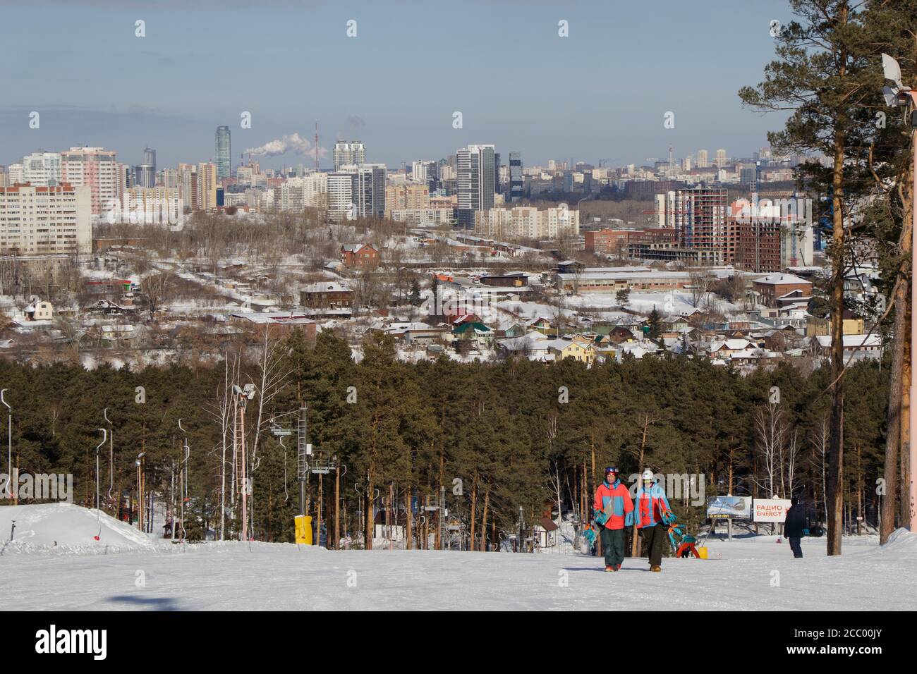 People are on the ski slope and view of the city of Yekaterinburg Stock Photo