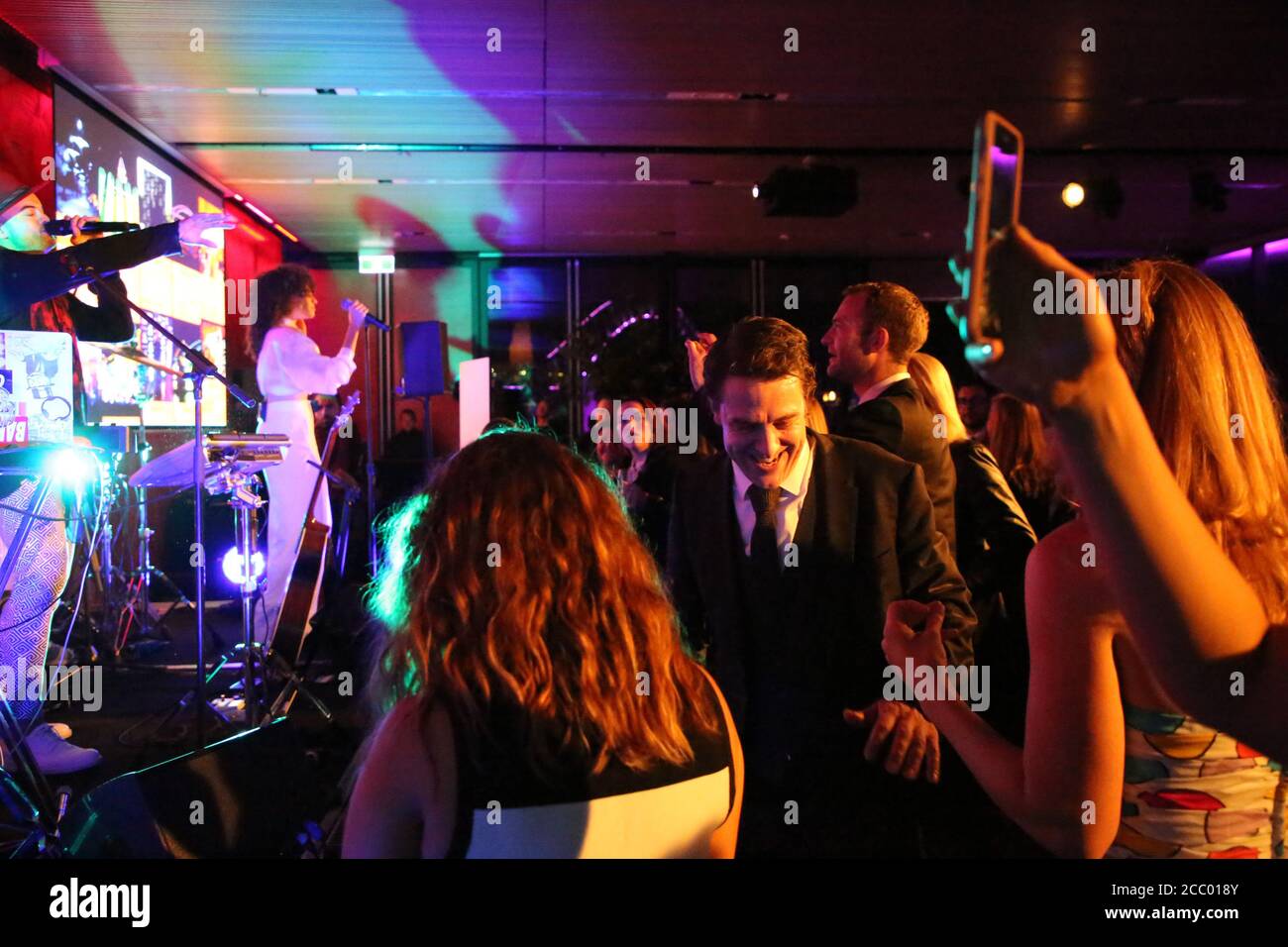 Samuel Johnson (2017 Gold Logie winner) daces to a Guy Sebastian performance at the Sensis x Vivid Sydney CEO Club event. Stock Photo