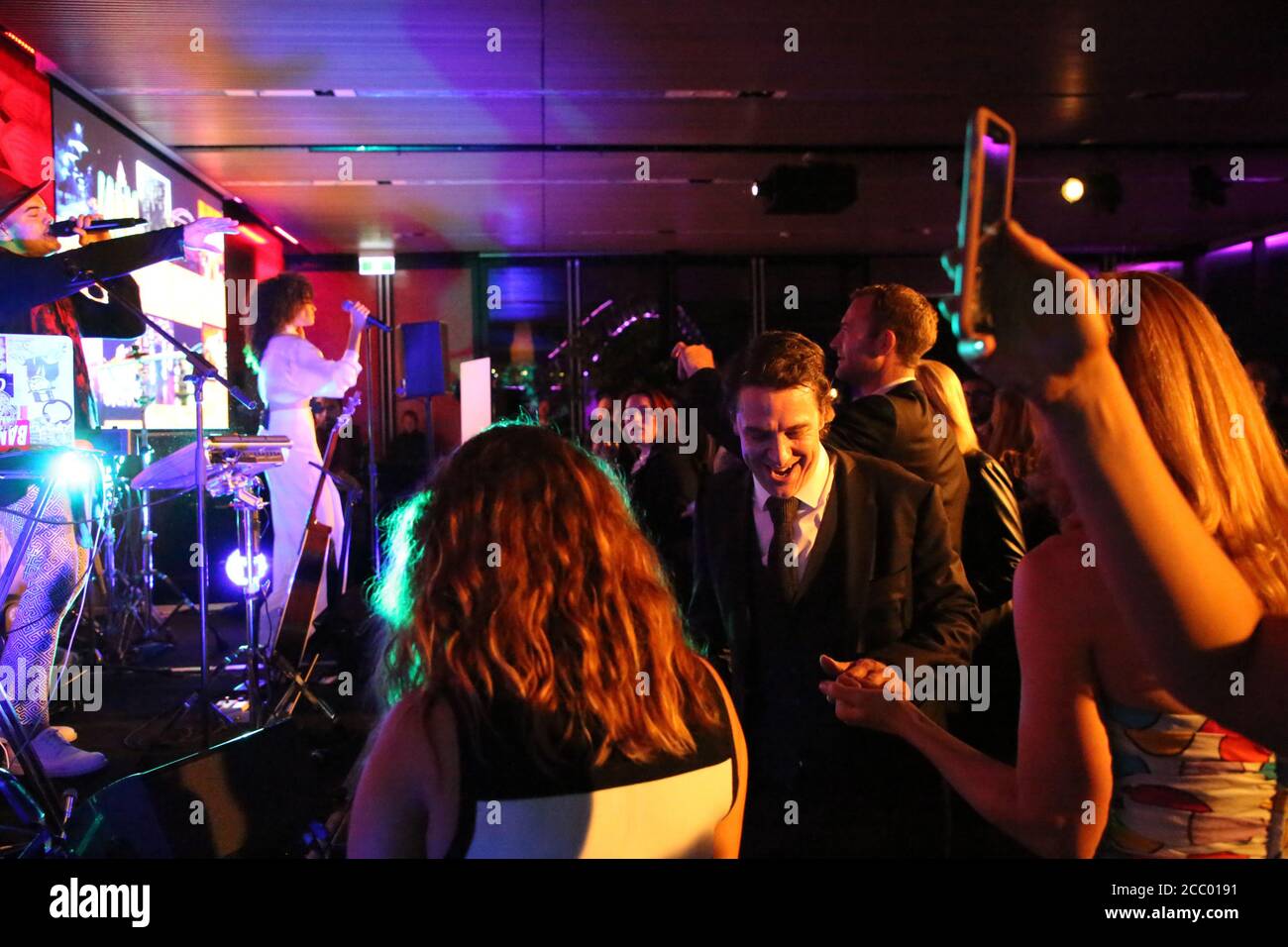 Samuel Johnson (2017 Gold Logie winner) daces to a Guy Sebastian performance at the Sensis x Vivid Sydney CEO Club event. Stock Photo