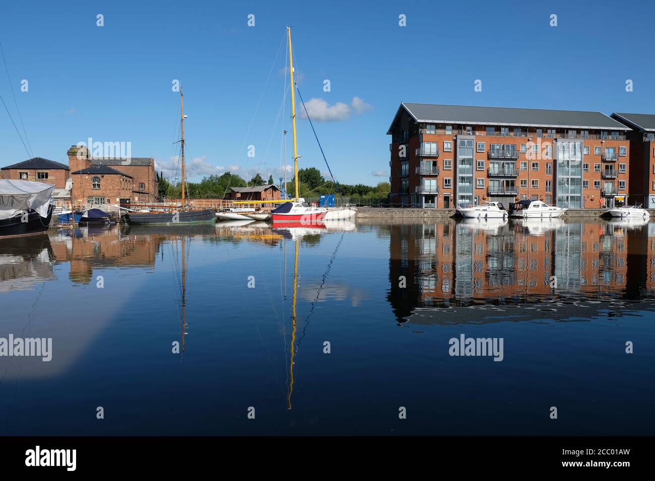 Boats moored in the main basin of Gloucester Docks on the Gloucester and Sharpness Canal in south-west England Stock Photo