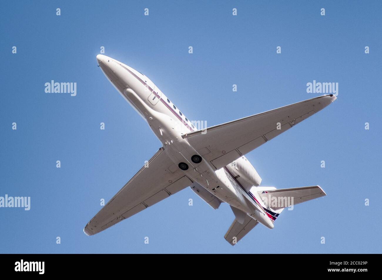 Private airplane ascending after take off from an airport in California Stock Photo