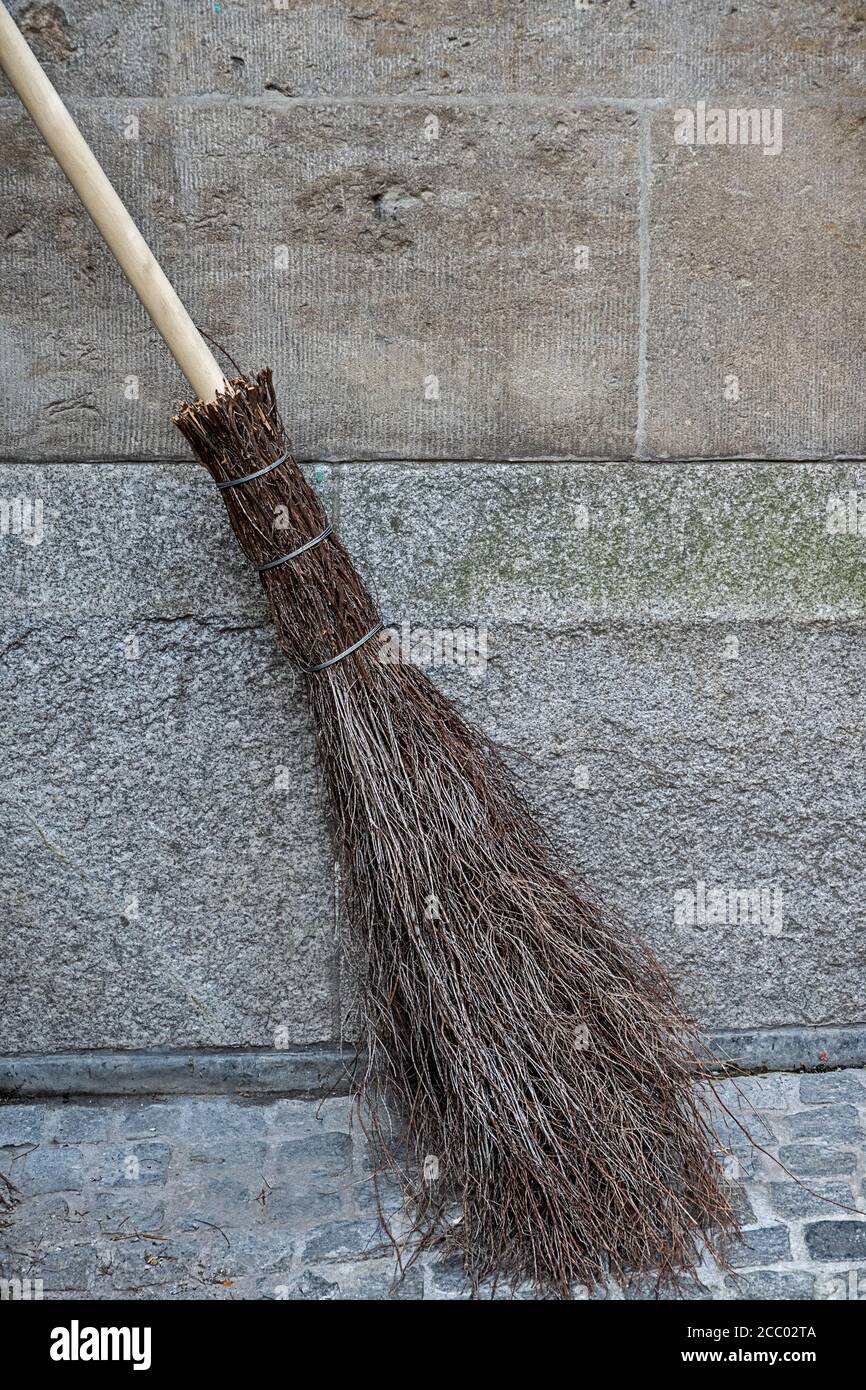sweeping up rubbish with a besom, just natural raw materials Stock Photo