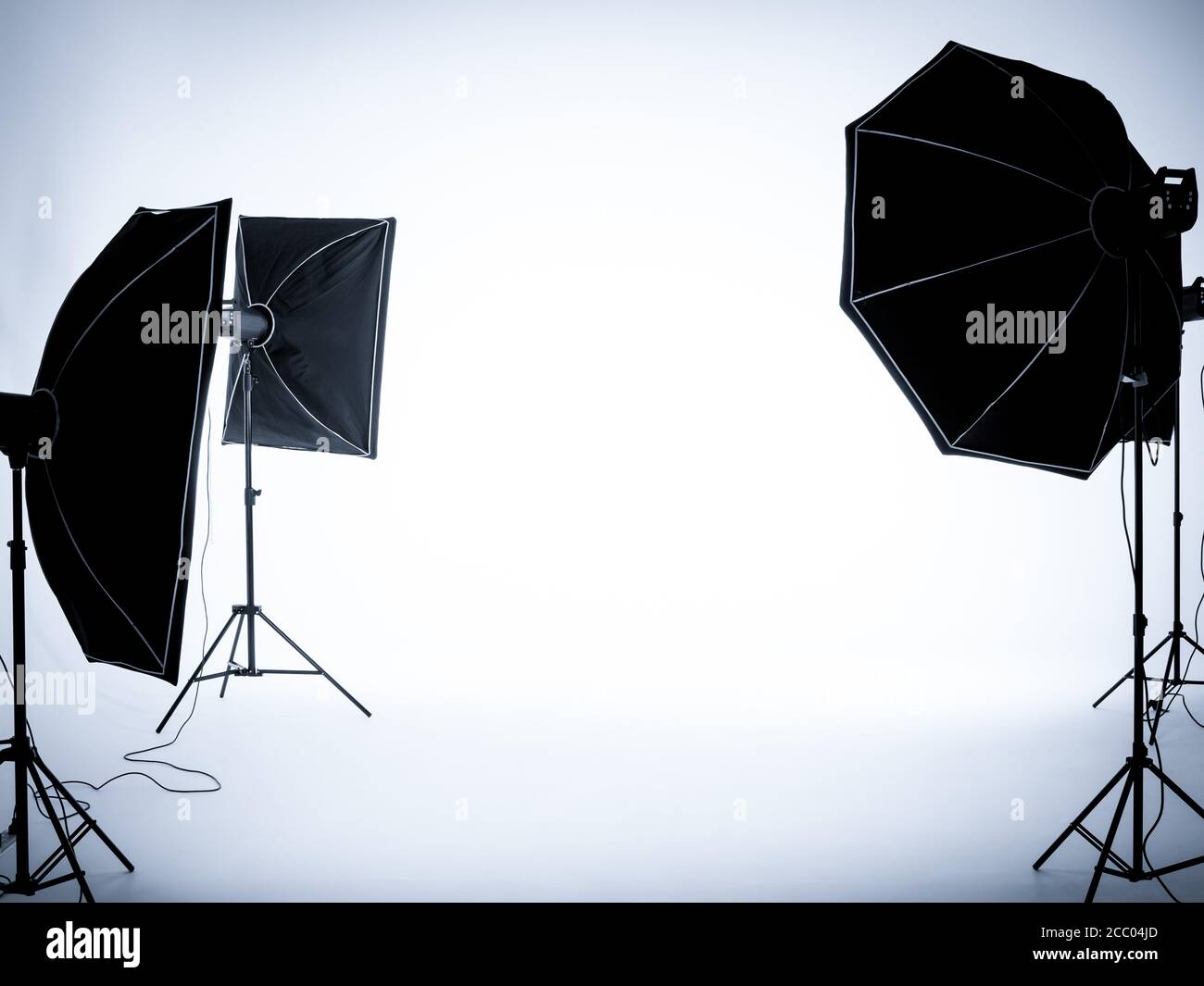 Empty white background in photography studio interior with lighting setup.  Empty photo studio with lighting equipment Stock Photo - Alamy