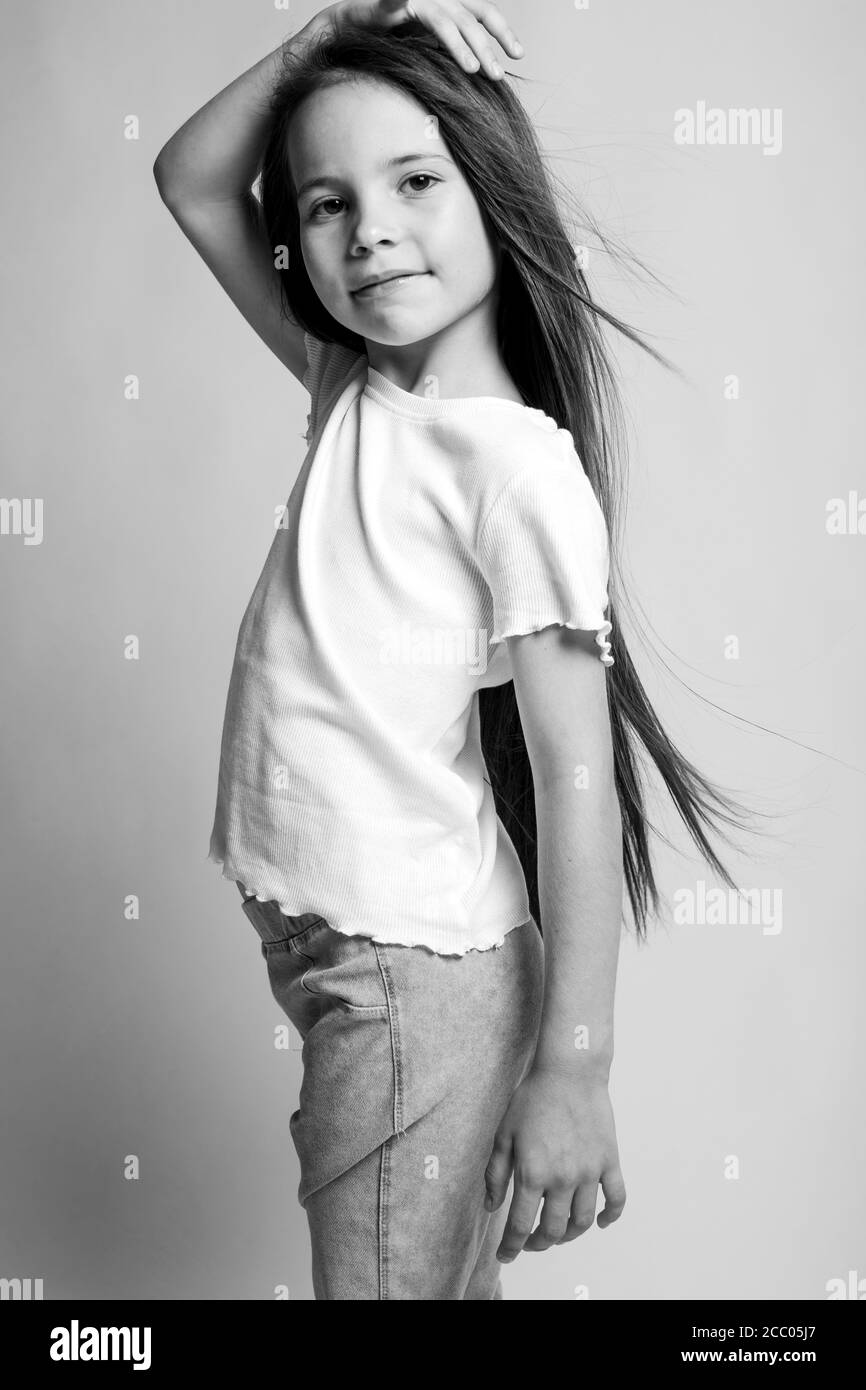 Beautiful child. Little girl in black and white studio Stock Photo - Alamy