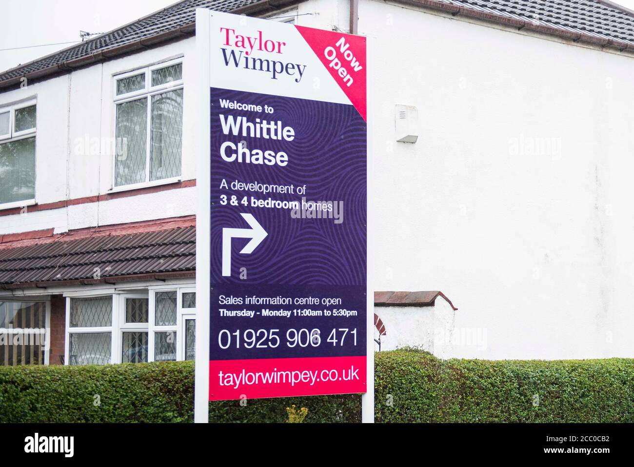 A sign shows directions to a housing development in Newton-le-Willows. Stock Photo