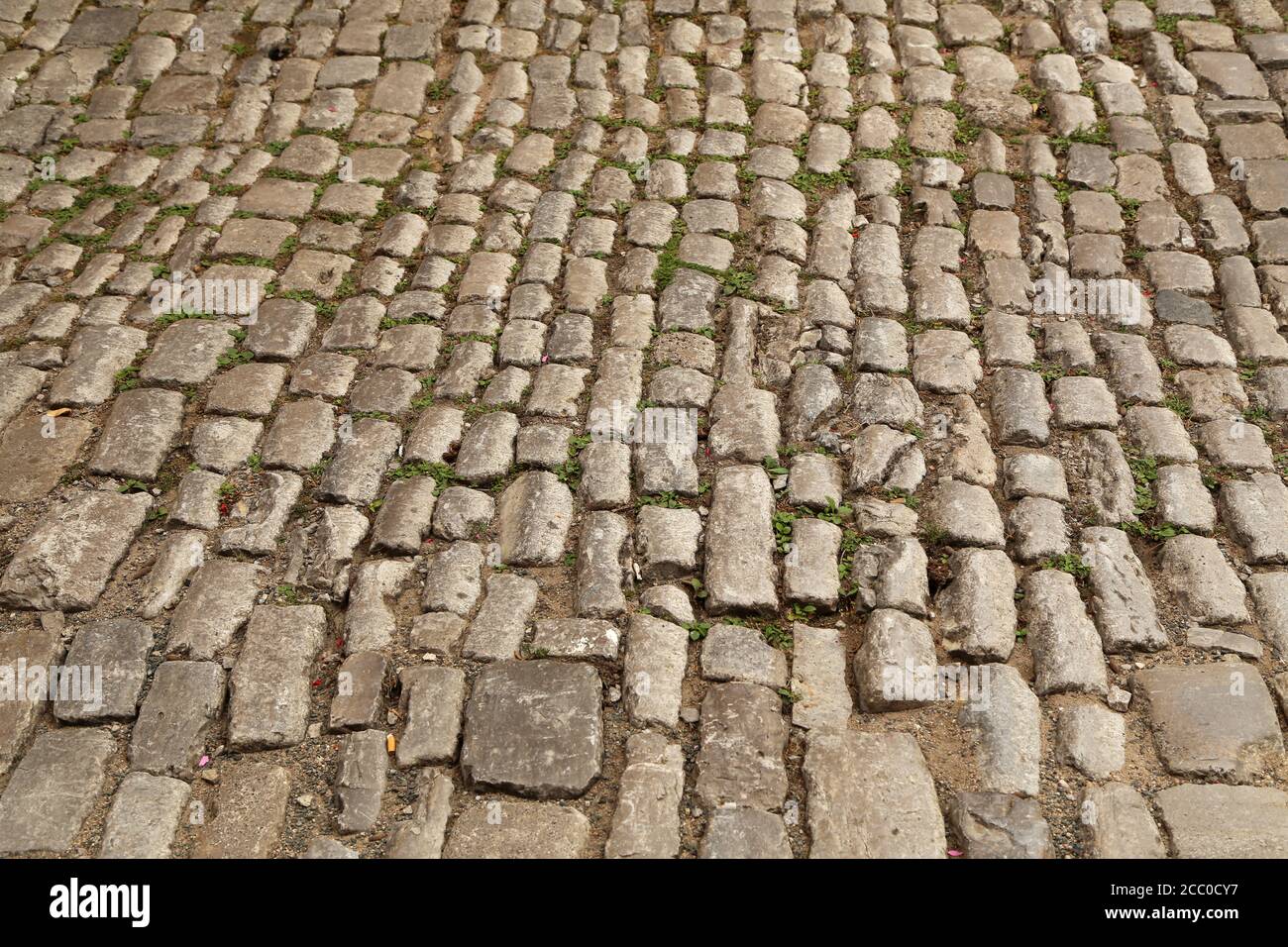 Abstract background of old cobblestone pavement close-up Stock Photo ...