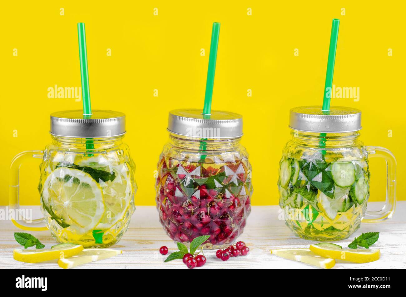 fresh summer bottles water with lemon, cucumber, currant and mint. sassy water for detox Stock Photo