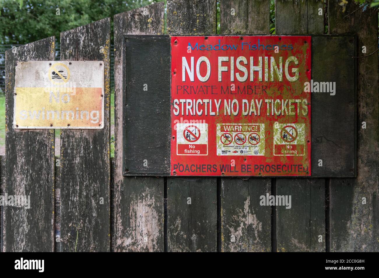 Battered metal No Fishing sign, Summer Leys, near Wellingborough, Northamptonshire, UK Stock Photo