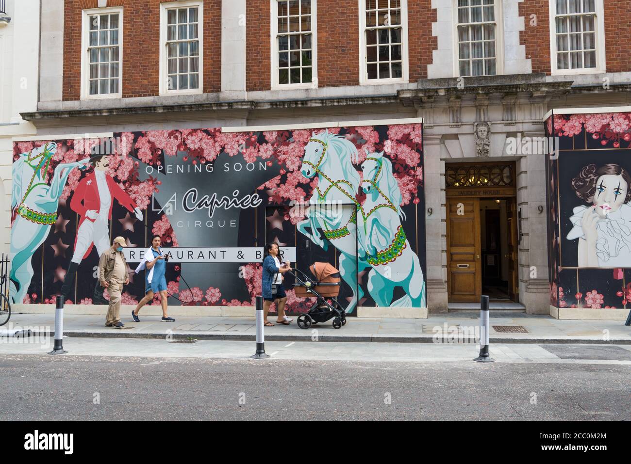 Decorative hoardings at the site of the development of the new La Caprice Cirque restaurant and bar in North Audley Street, Mayfair, London, England Stock Photo