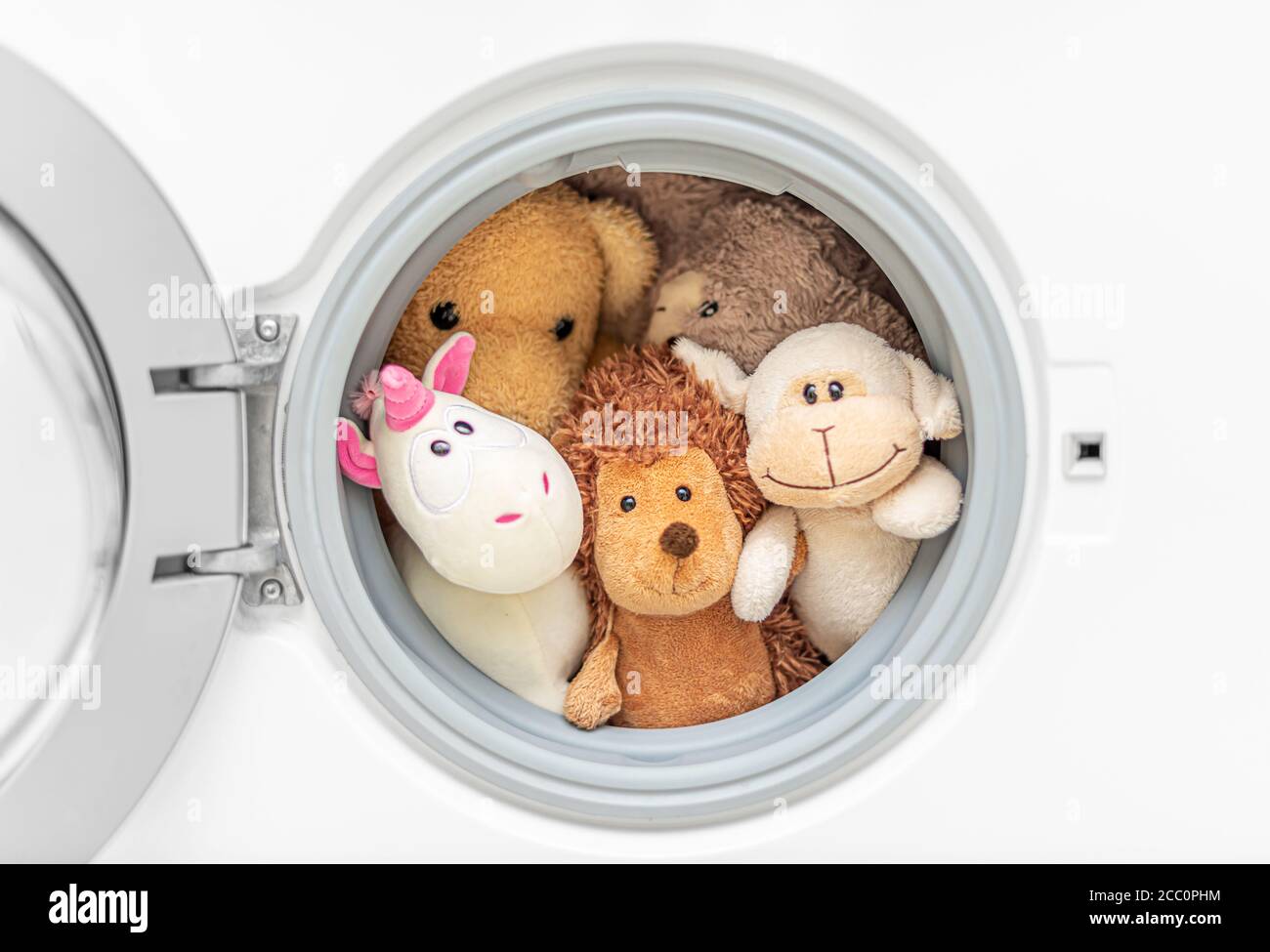 Plush toys are being prepared for washing Stock Photo Alamy