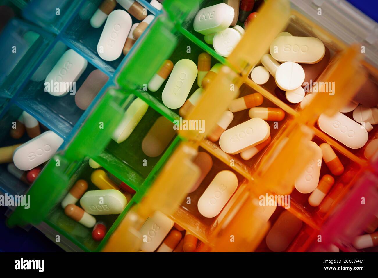 Medication, including anti rejection drugs, after a kidney transplant, stored in a weekly pill box Stock Photo