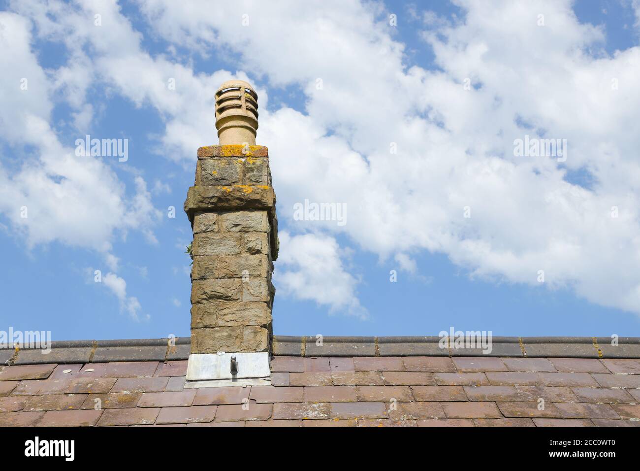 Chimney pot on old victorian house roof uk Stock Photo