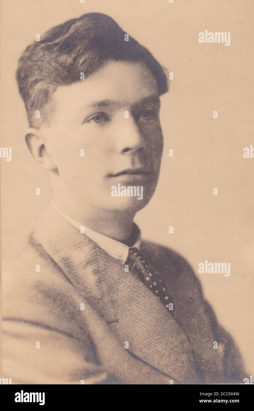 Vintage black and white photo of a young man 1900s Stock Photo
