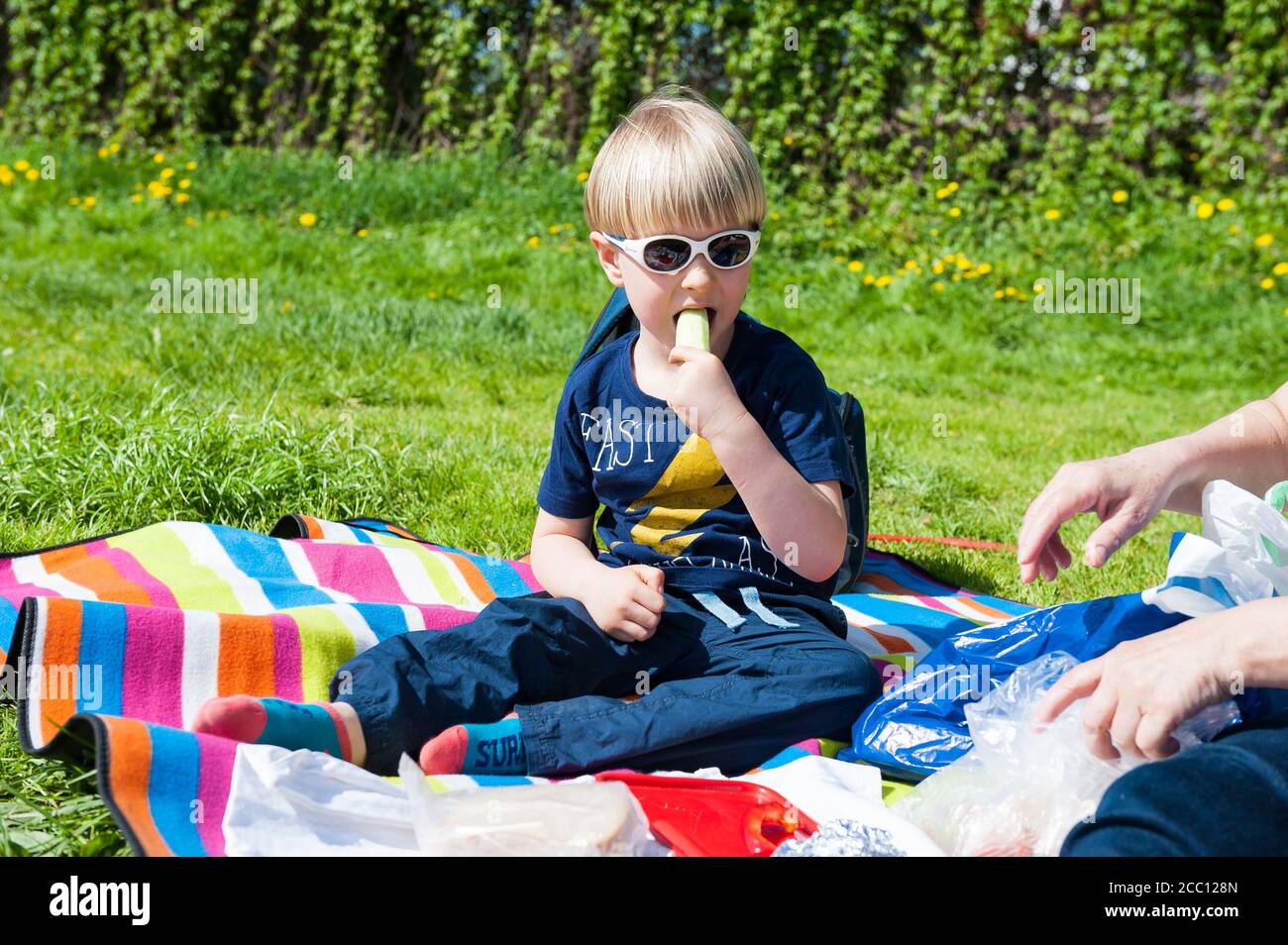 4 year old boy eating vegetables Stock Photo - Alamy