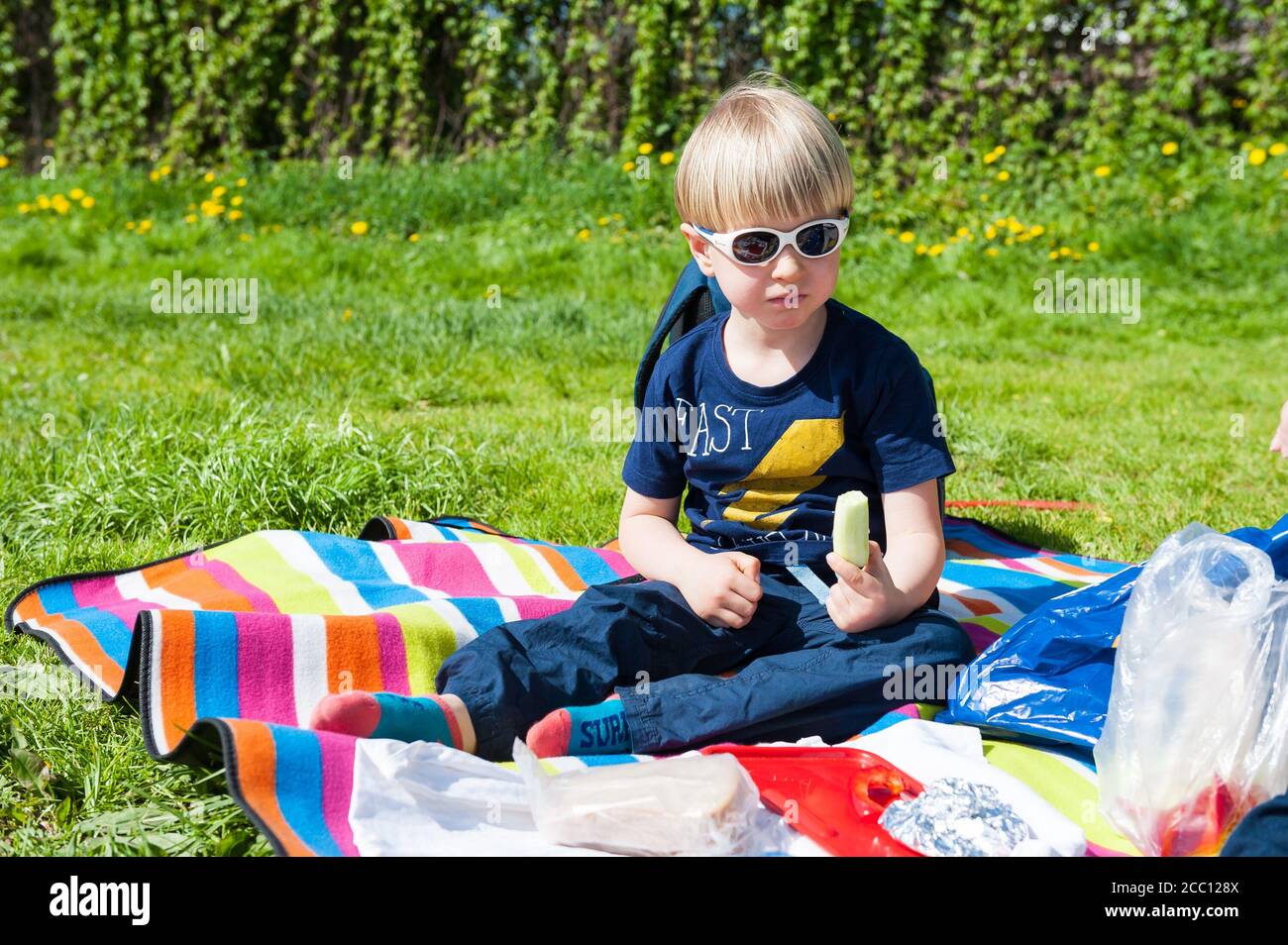 4 year old boy eating vegetables Stock Photo - Alamy