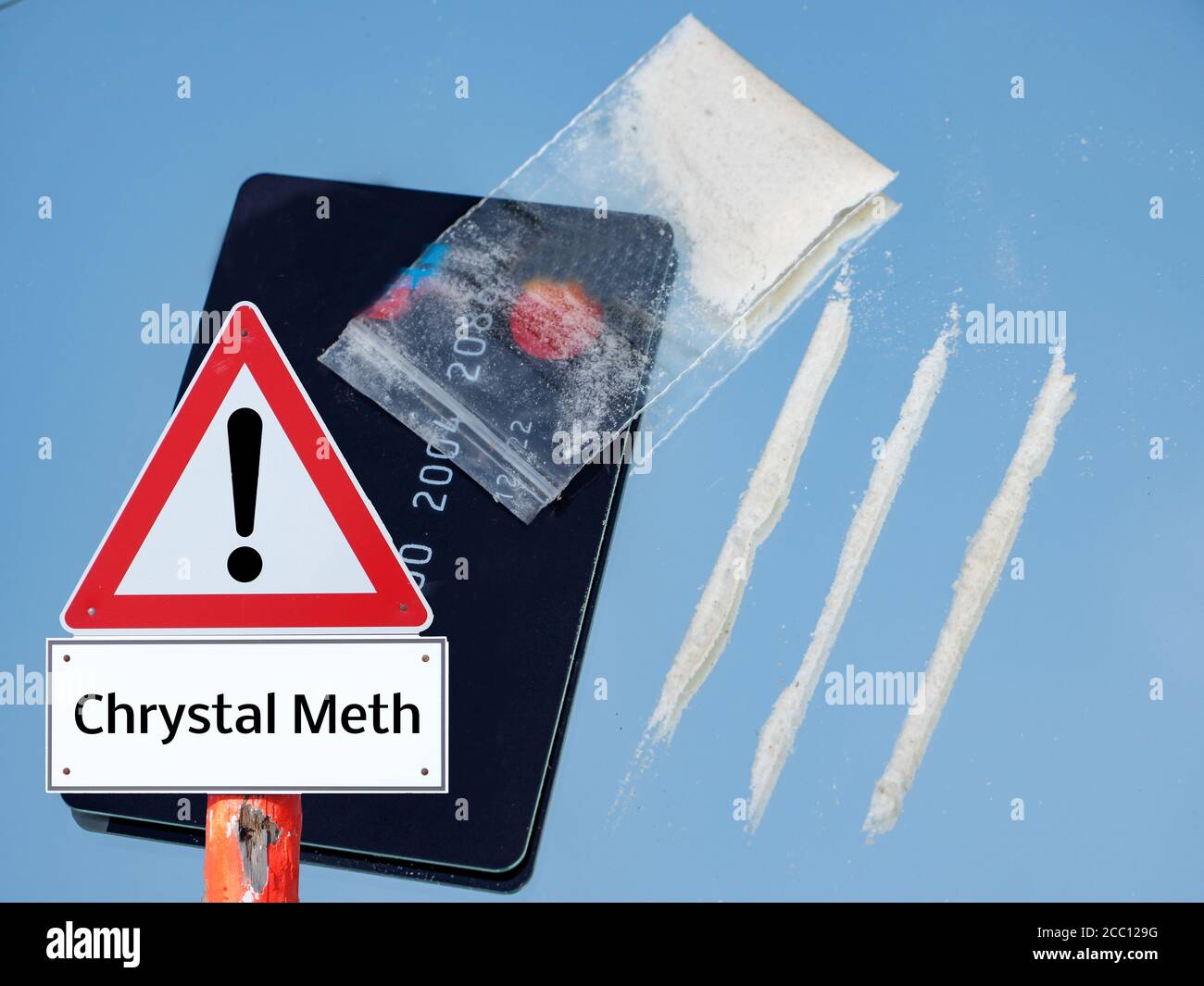 crystal meths line with money card and bag warning sign Stock Photo