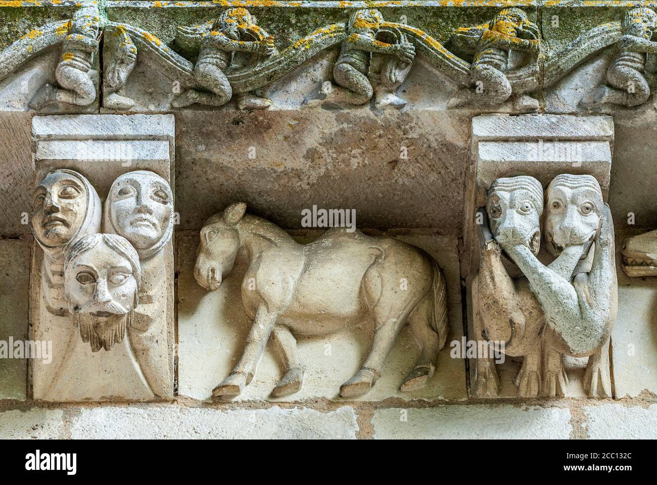 France, Charente Maritime, Surgeres, church of Notre Dame, bas-relief and  corbels of the facade Stock Photo - Alamy