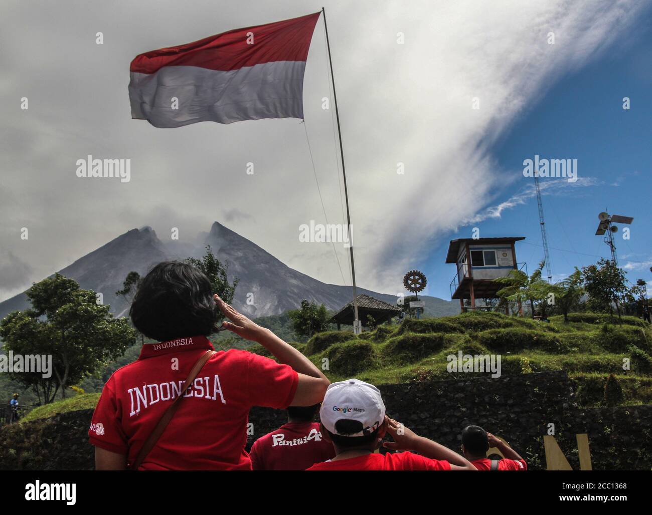 Sleman, YOGYAKARTA, INDONESIA. 17th Aug, 2020. Indonesian tourists salute the Red and White Flag when marking the 75th anniversary of the independence of the Republic of Indonesia in Cangkringan, Sleman, Yogyakarta, Indonesia, Monday, 17 August 2020. Indonesia became independent in 1945 from Dutch colonialism. Credit: Slamet Riyadi/ZUMA Wire/Alamy Live News Stock Photo