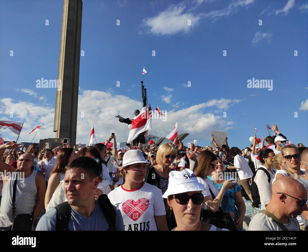 Minsk / Belarus - August 16 2020: Thousands of demonstrators standing at the stairs of the Minsk Hero City Obelisk with the Motherland Status during t Stock Photo