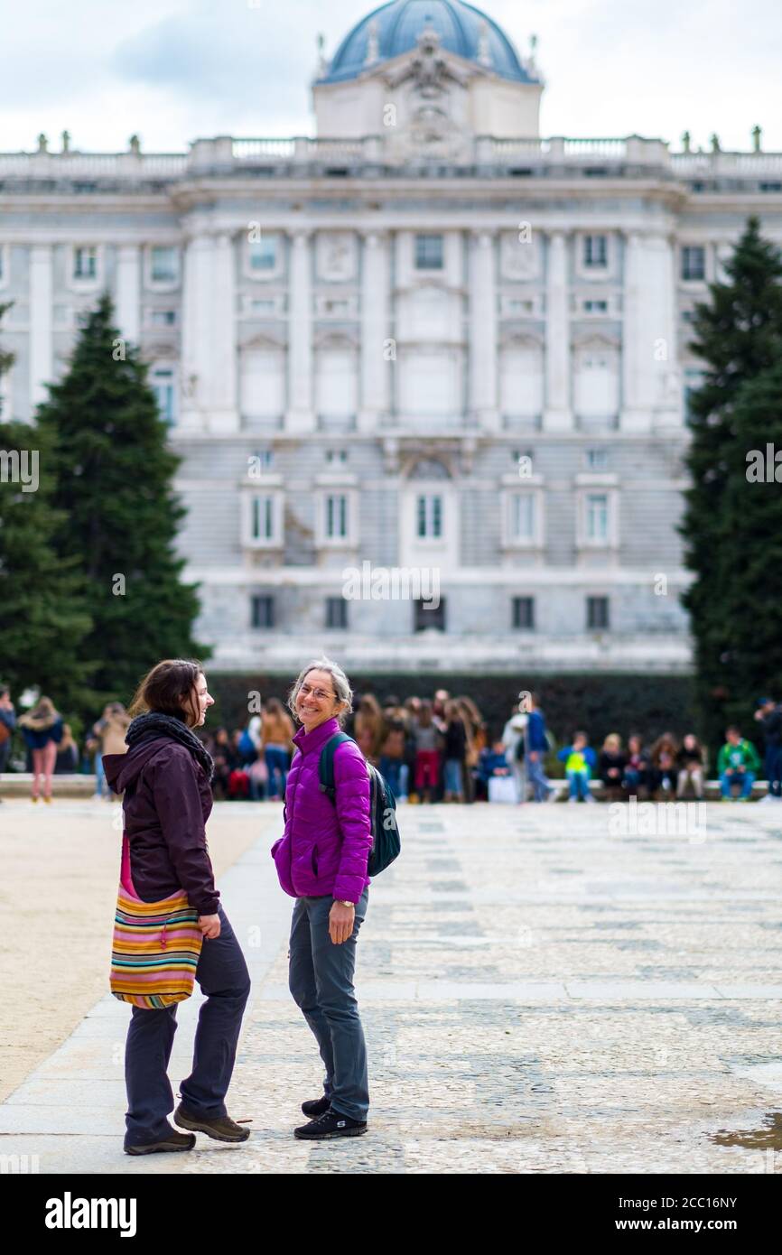 MADRID, SPAIN - Mar 25, 2015: Madrid / Spain - March 24 2015: Mother and Daughter Caucasian Women Standing in a Park, Talking and Laughing each other Stock Photo
