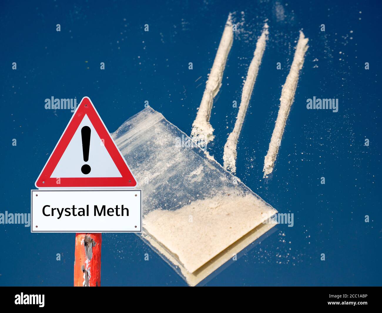 Drugs Lines on a mirror with bag warning sign dangerous Stock Photo