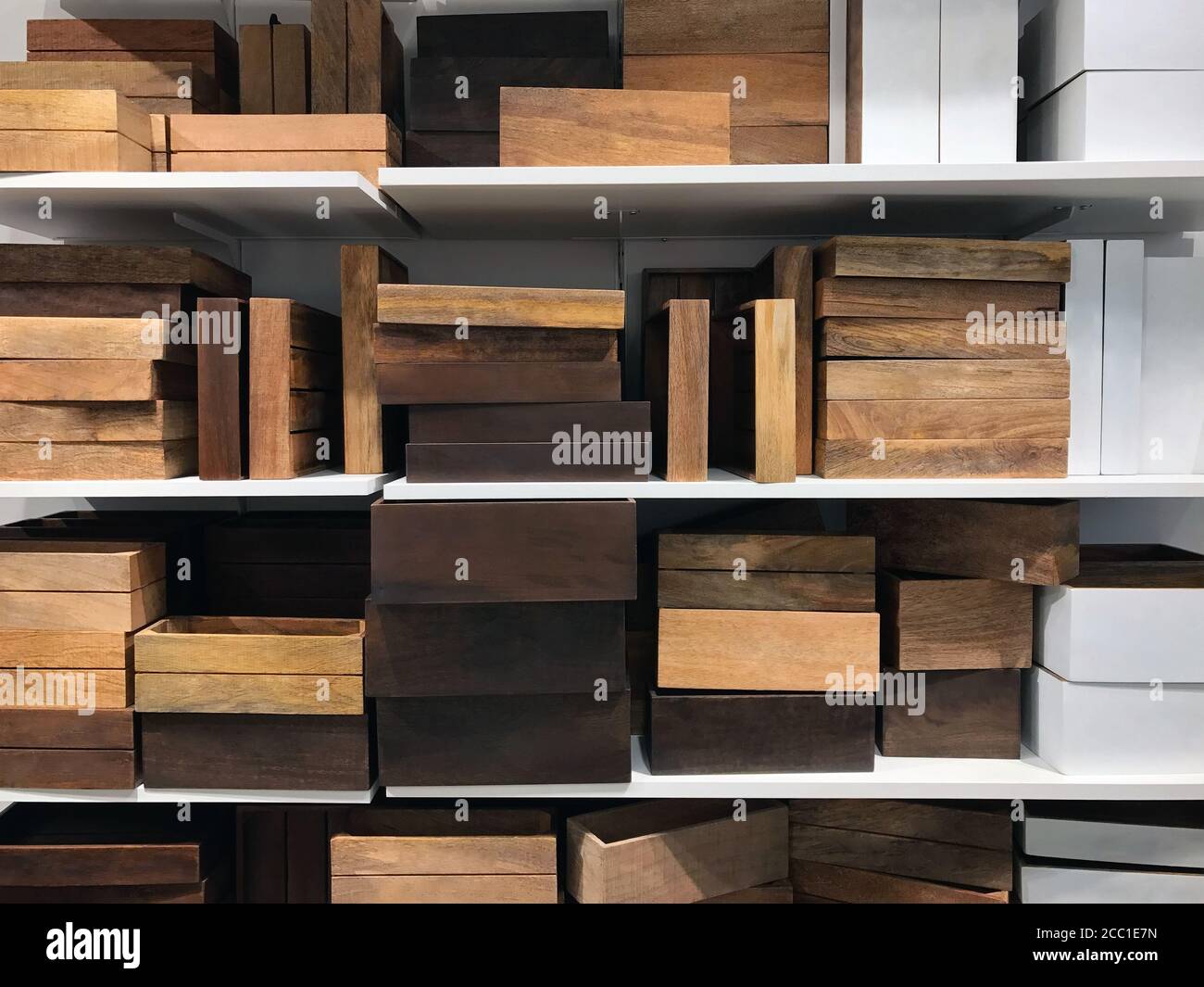 Lot of wooden boxes on the shelves of the store Stock Photo - Alamy