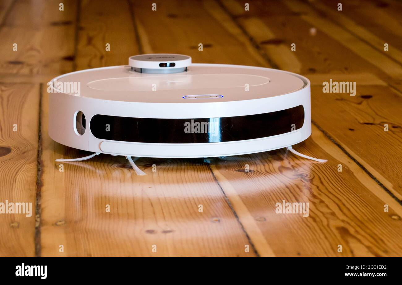 Robot Vacuum Cleaner - Working On Wooden (Parquet) Floor - Moving Stock  Photo - Alamy