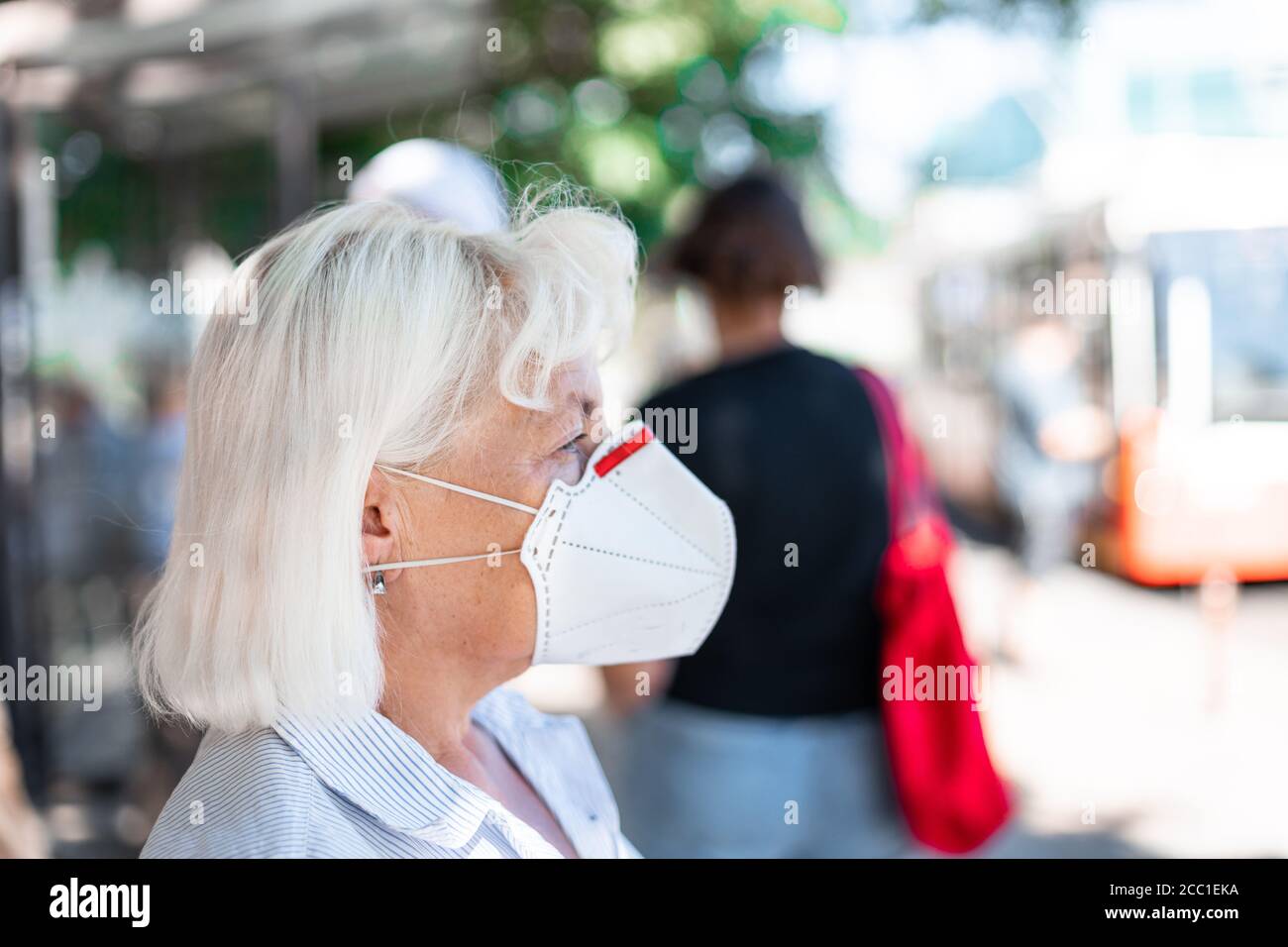 Chinese woman waiting bus stop hi-res stock photography and images - Alamy