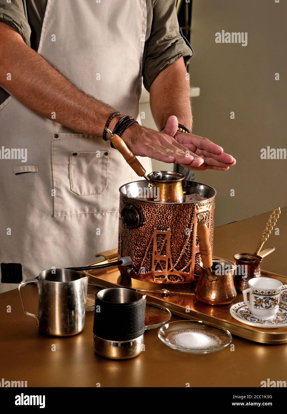 Traditional Turkish coffee brewed in heated sand. Preparation process