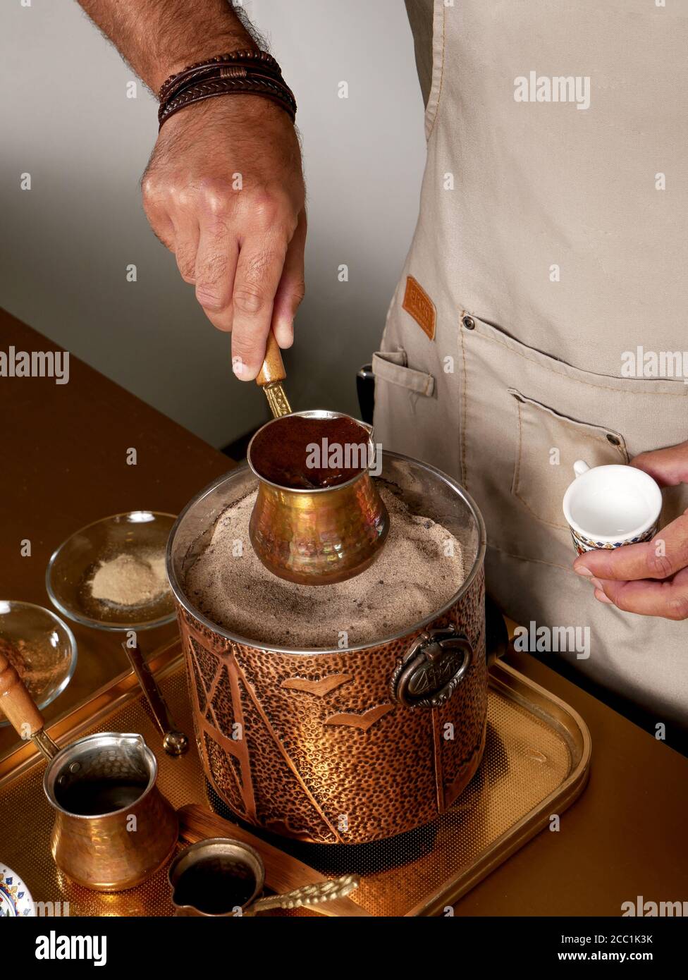 Traditional Turkish coffee brewed in heated sand. Preparation process