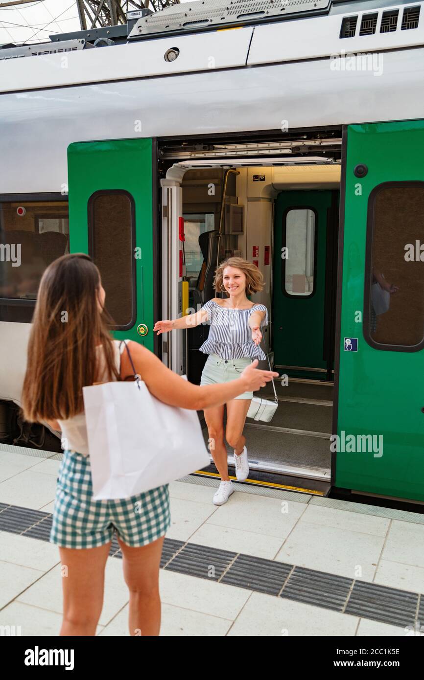 Woman getting off train railway hi-res stock photography and images - Alamy