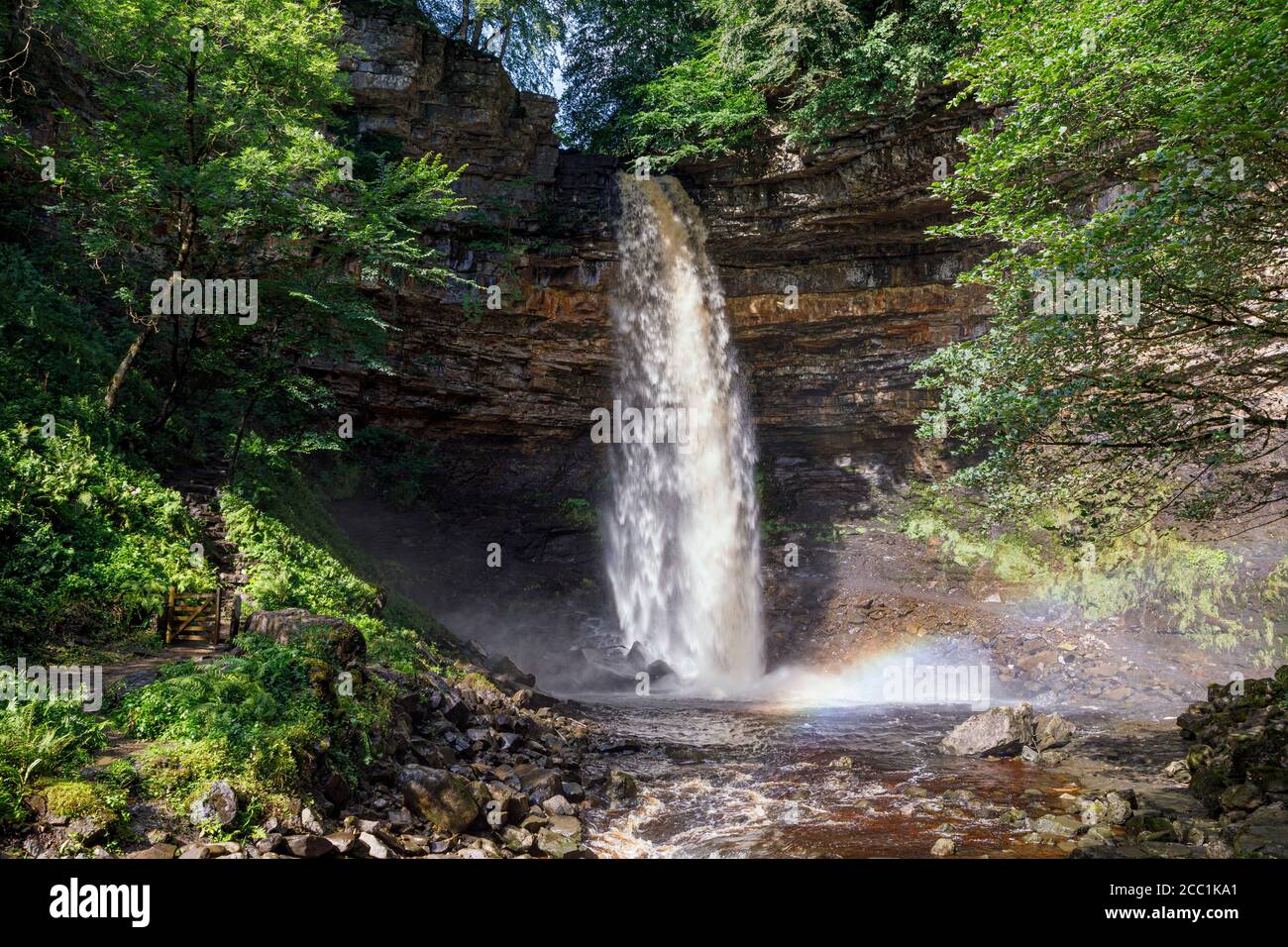 A rainbow created by the spray at Hardraw Force, Wensleydale, Yorkshire Dales National Park, England Stock Photo