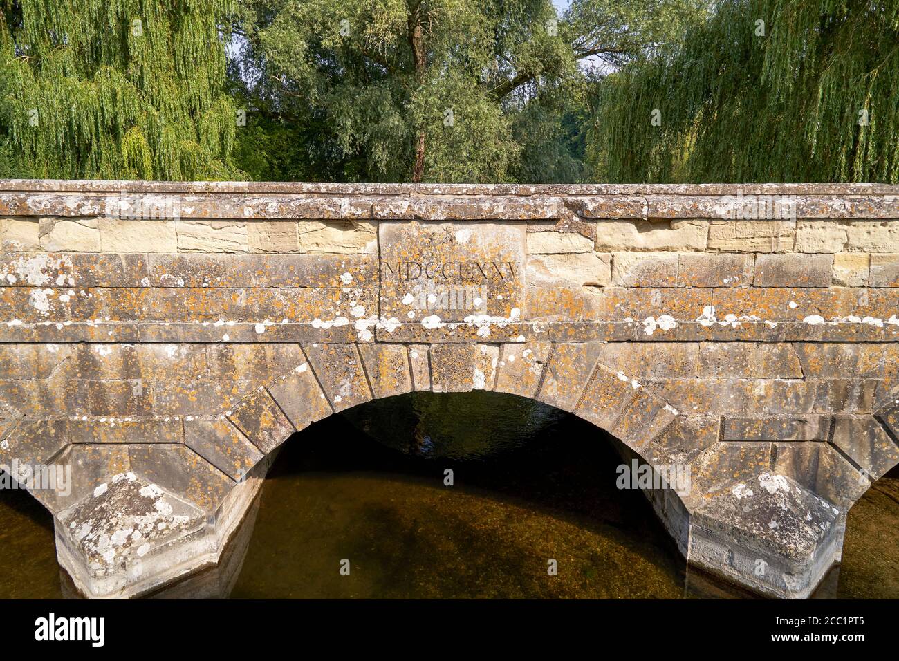 Old stone bridge over the River Avon with Roman script Stock Photo