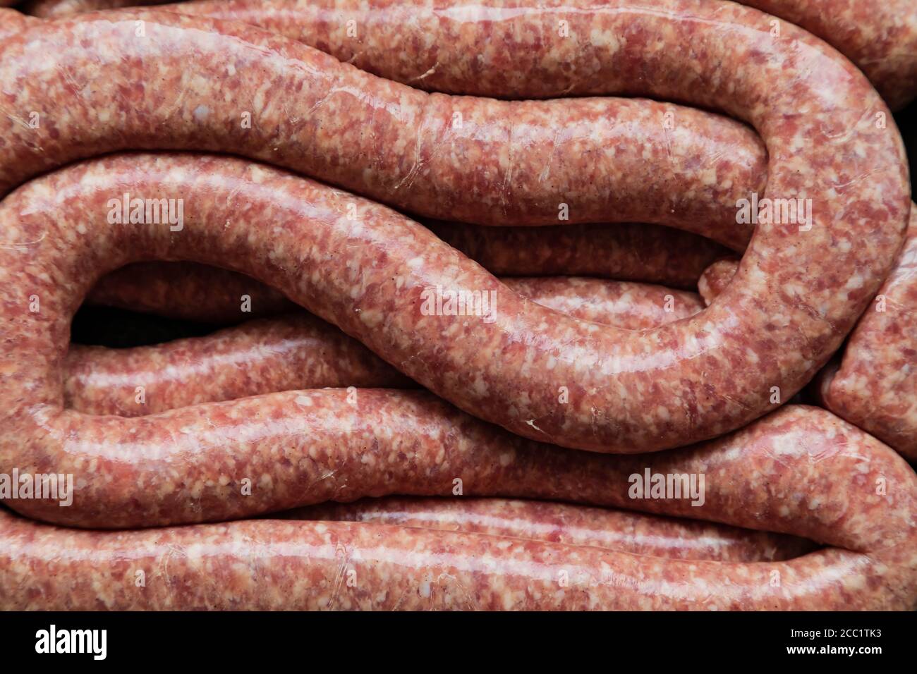Freshly made traditional Cumberland sausage length. Not usually linked, but served coiled or in lengths. Stock Photo