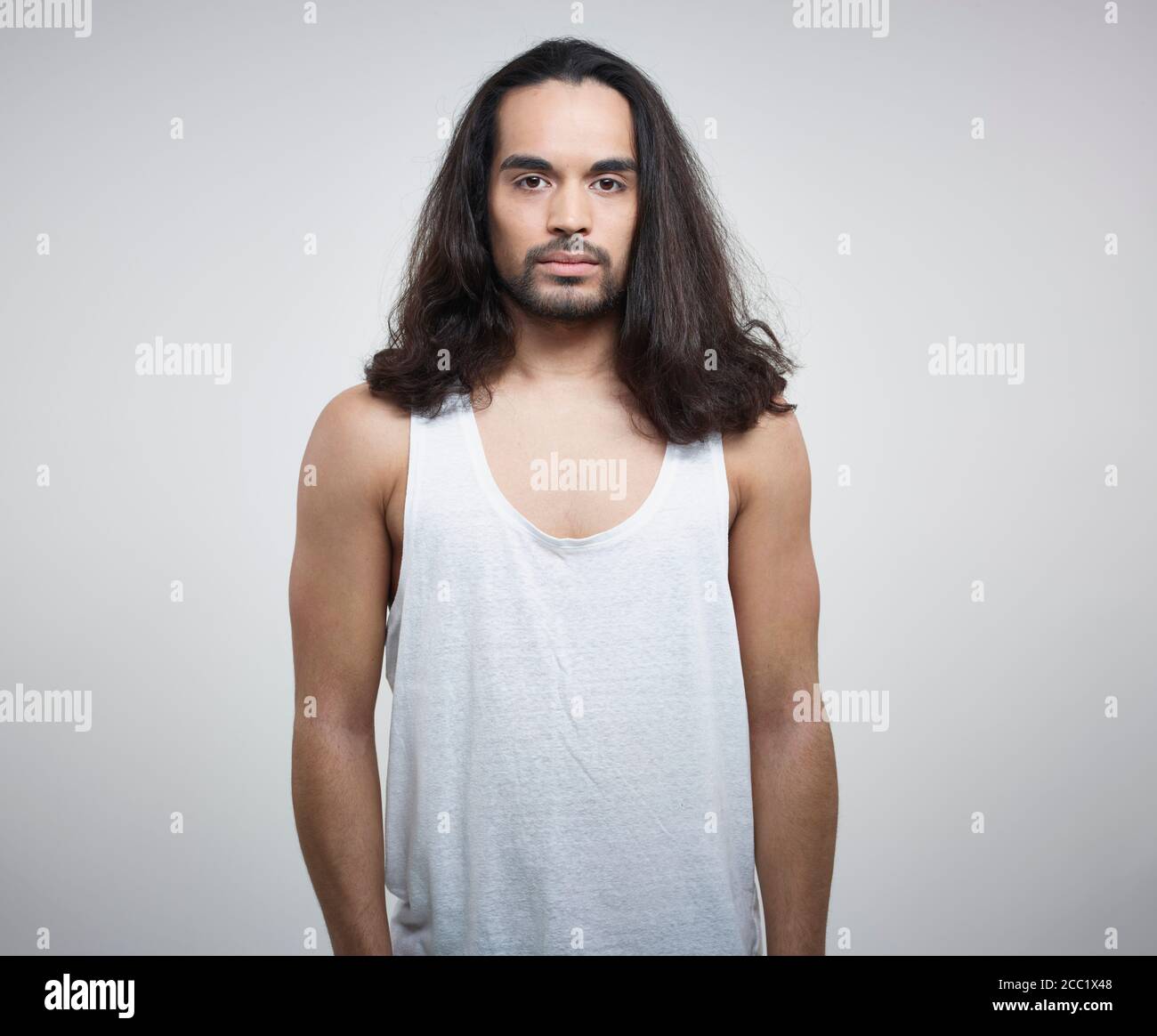 Portrait of young man against white background Stock Photo - Alamy