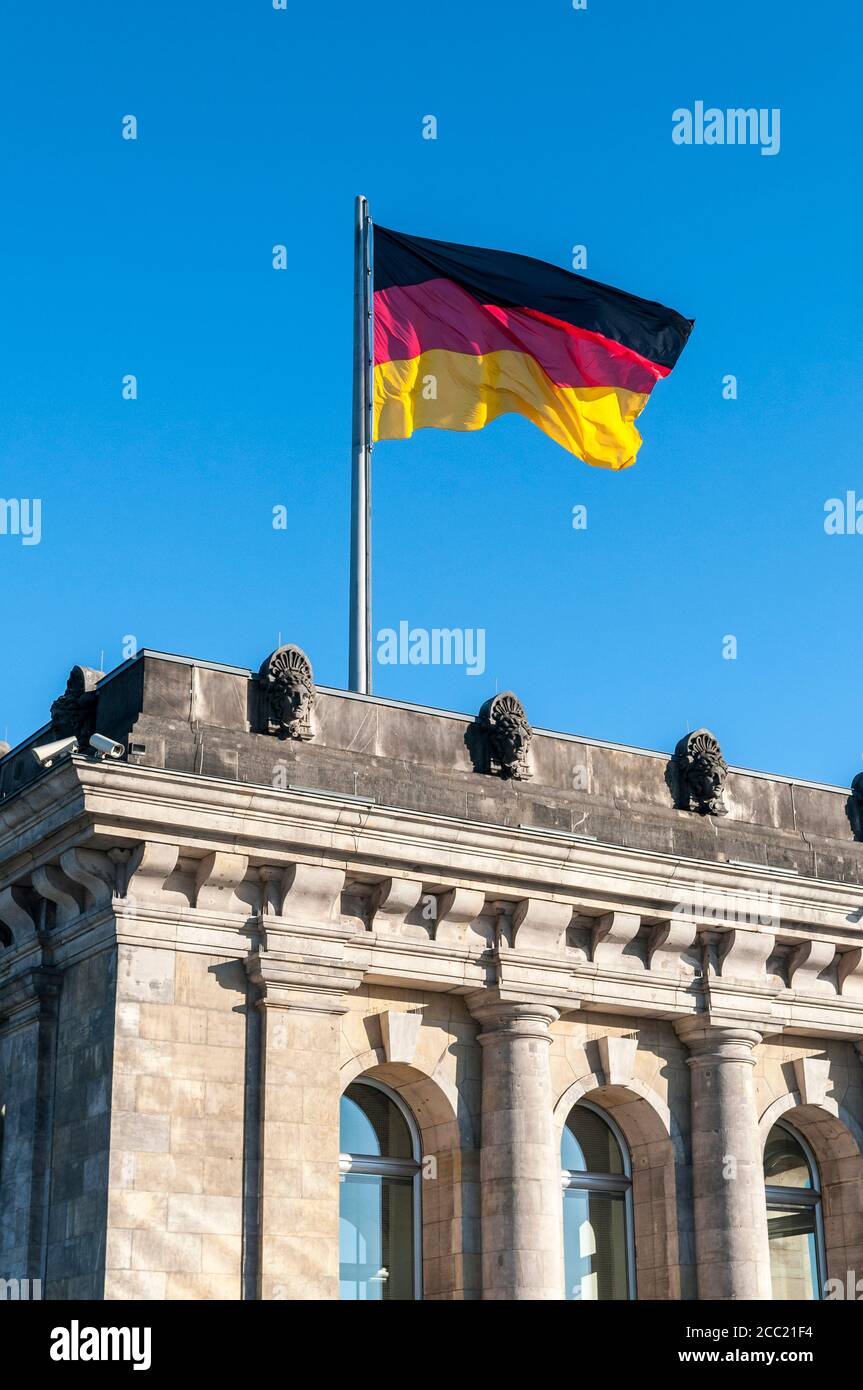 Germany, Berlin, View of Reichstag building with German flag Stock Photo