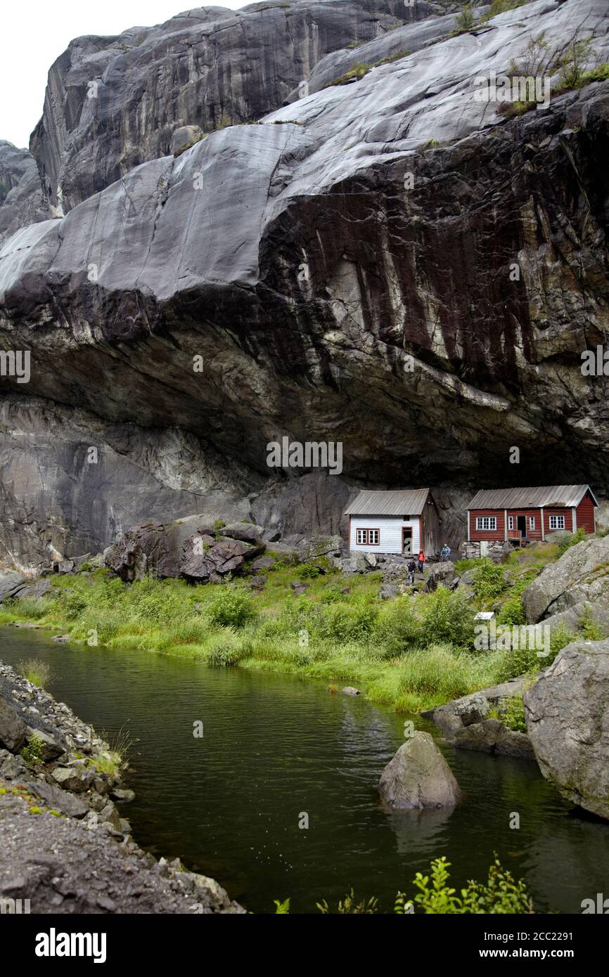 Norway, View of old fisher houses under mountain at Helleren Stock Photo