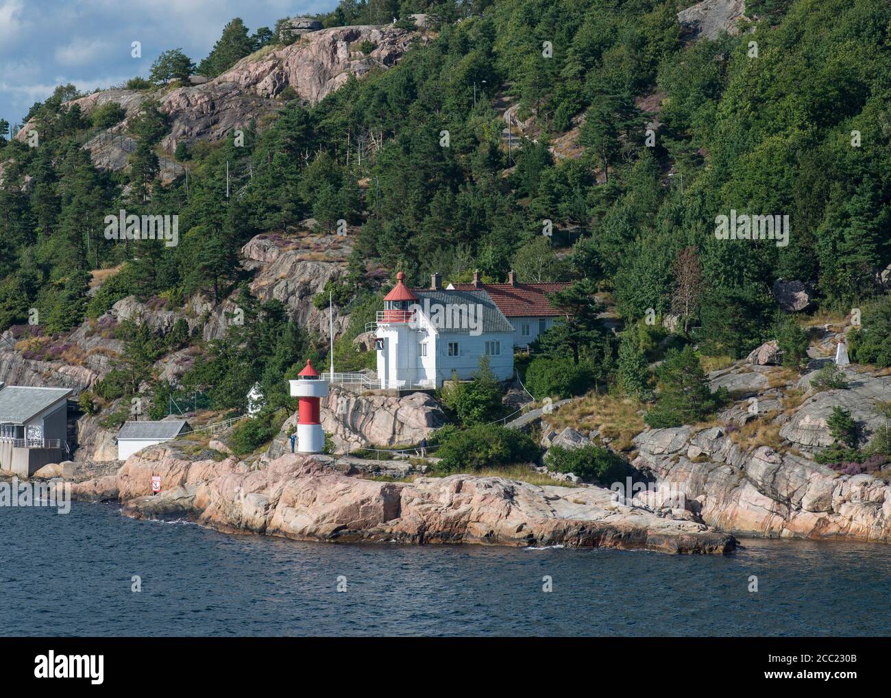 Norway, Museum and lighthouse at harbor Stock Photo