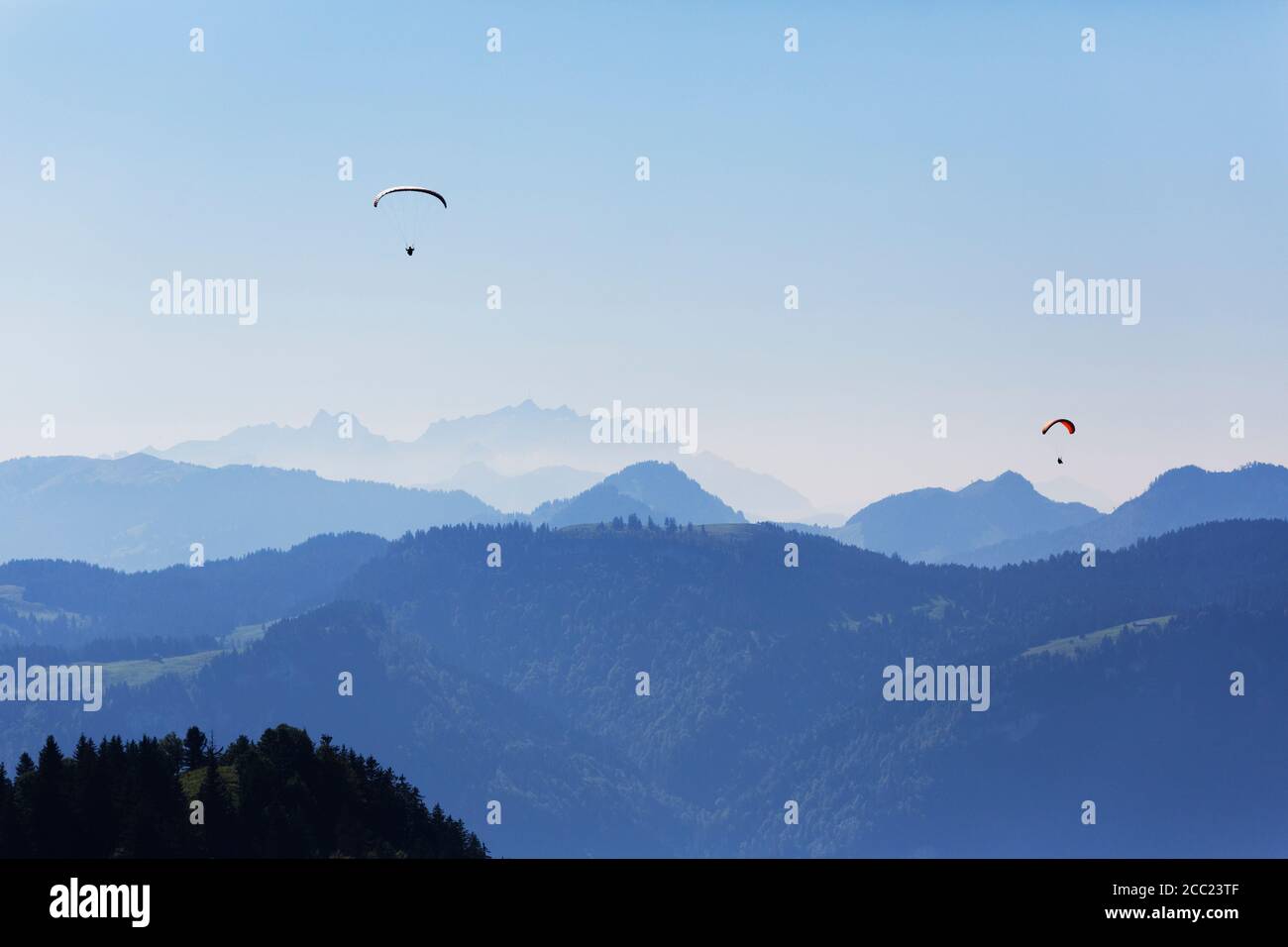 Austria, Vorarlberg, Paraglider flying over Niedere mountain Stock Photo
